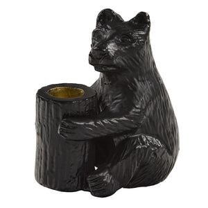 Black bear-shaped candle holder on a white background