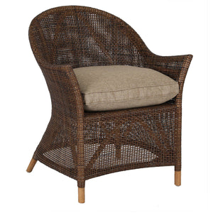 Wicker armchair with cushion on a white background