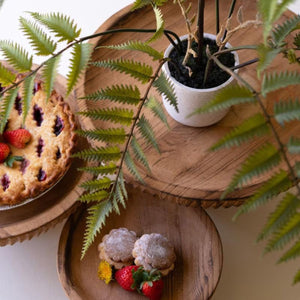Overhead view of etched wood serving stands with treats