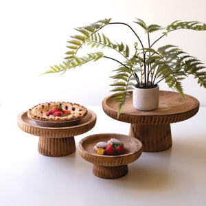 Etched wood serving stands set of 3 styled with a fern and fruit