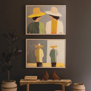 Two framed portrait paintings in earthy tones
