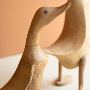Close-up of carved wooden duck heads