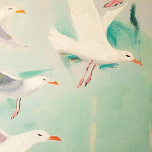 Close-up of painted white seagulls over sea green and blue