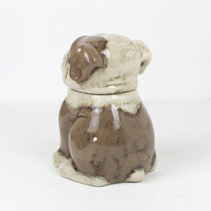 Side view of brown and cream ceramic bulldog jar
