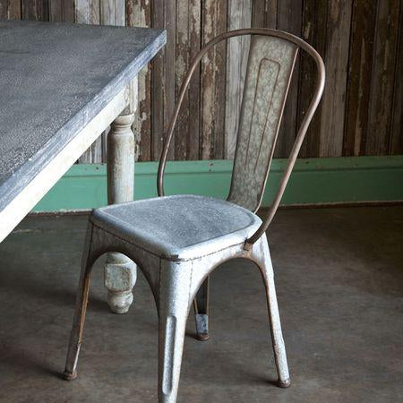 Iron dining chair beside a dining table