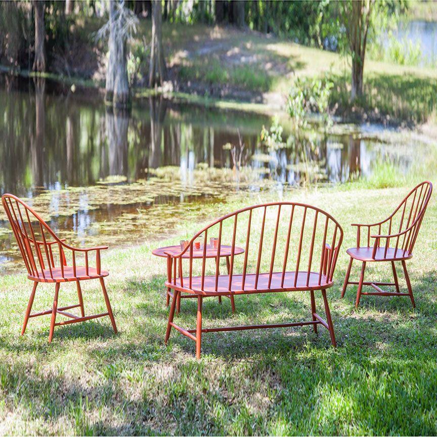 Cast aluminum patio furniture arranged for outdoor dining