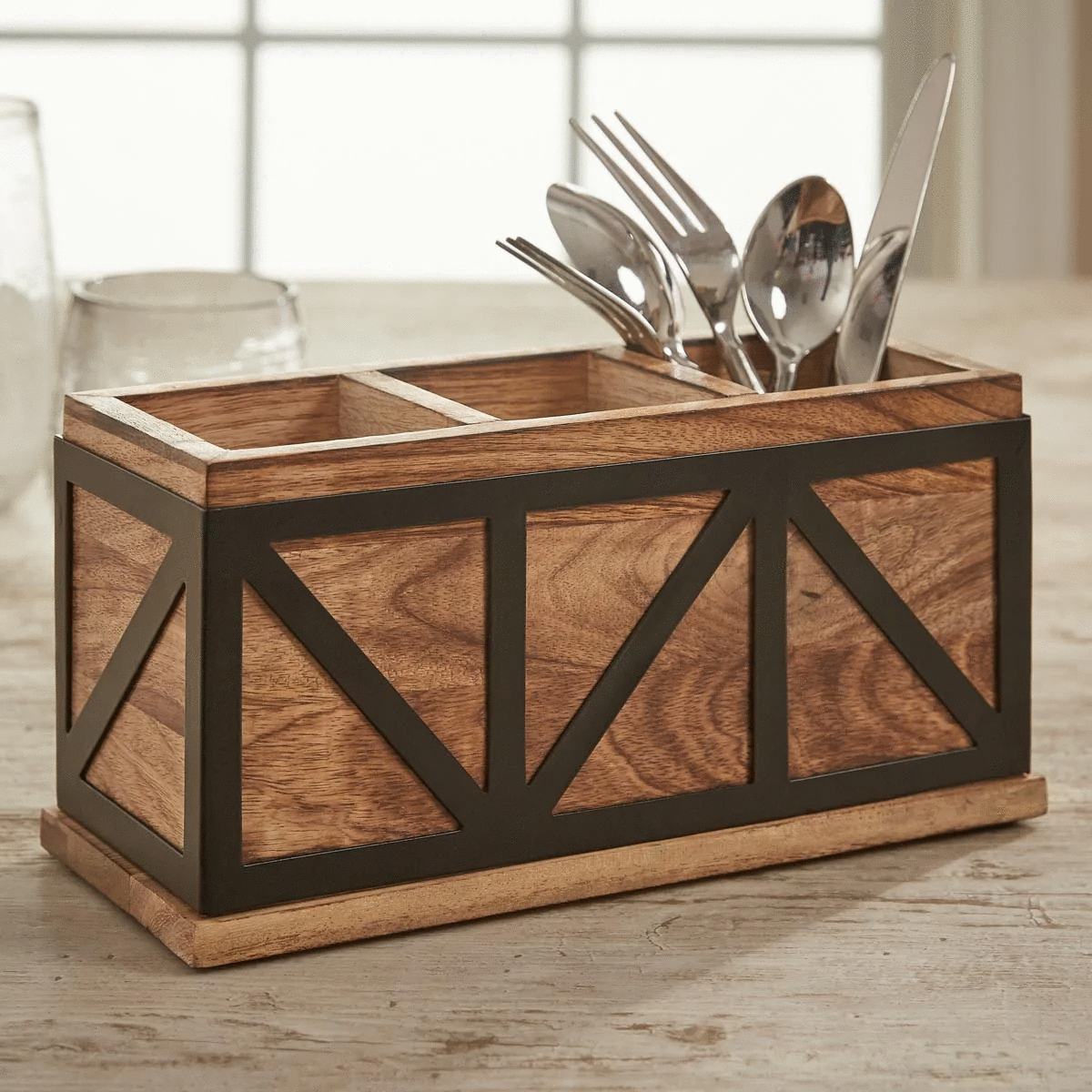 Kitchen counter caddy holding utensils and everyday supplies