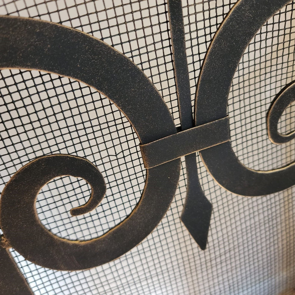 Close-up of decorative metal screen with intricate design