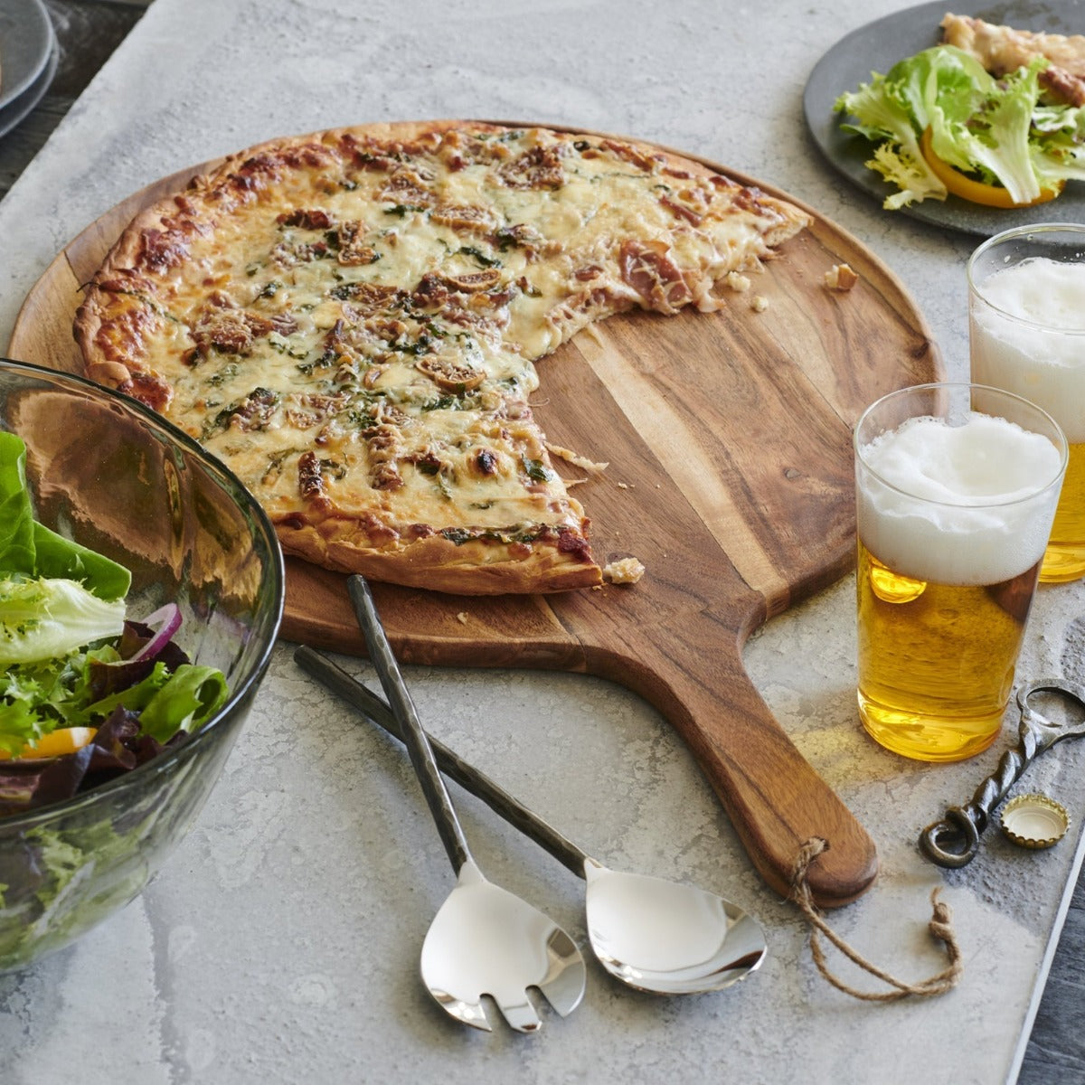 Acacia wood serving board styled for bread and cheese