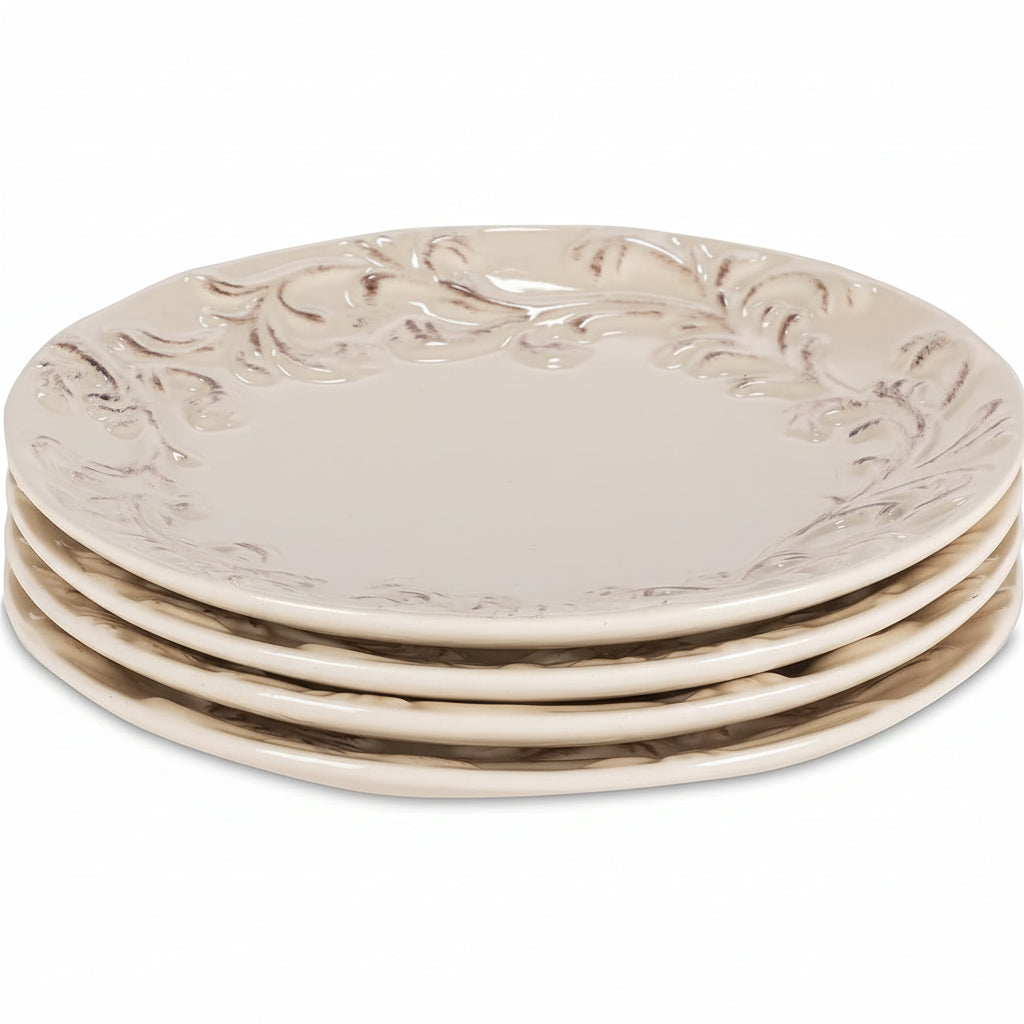 Set of four decorative ceramic plates with intricate designs on a white background