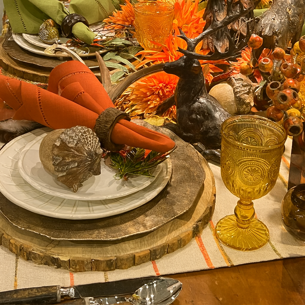 Layered fall table decor with warm autumn color and sculptural accents