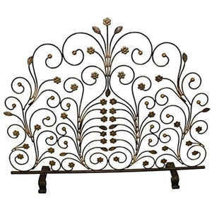 Decorative metal headboard with floral and scroll designs on a white background