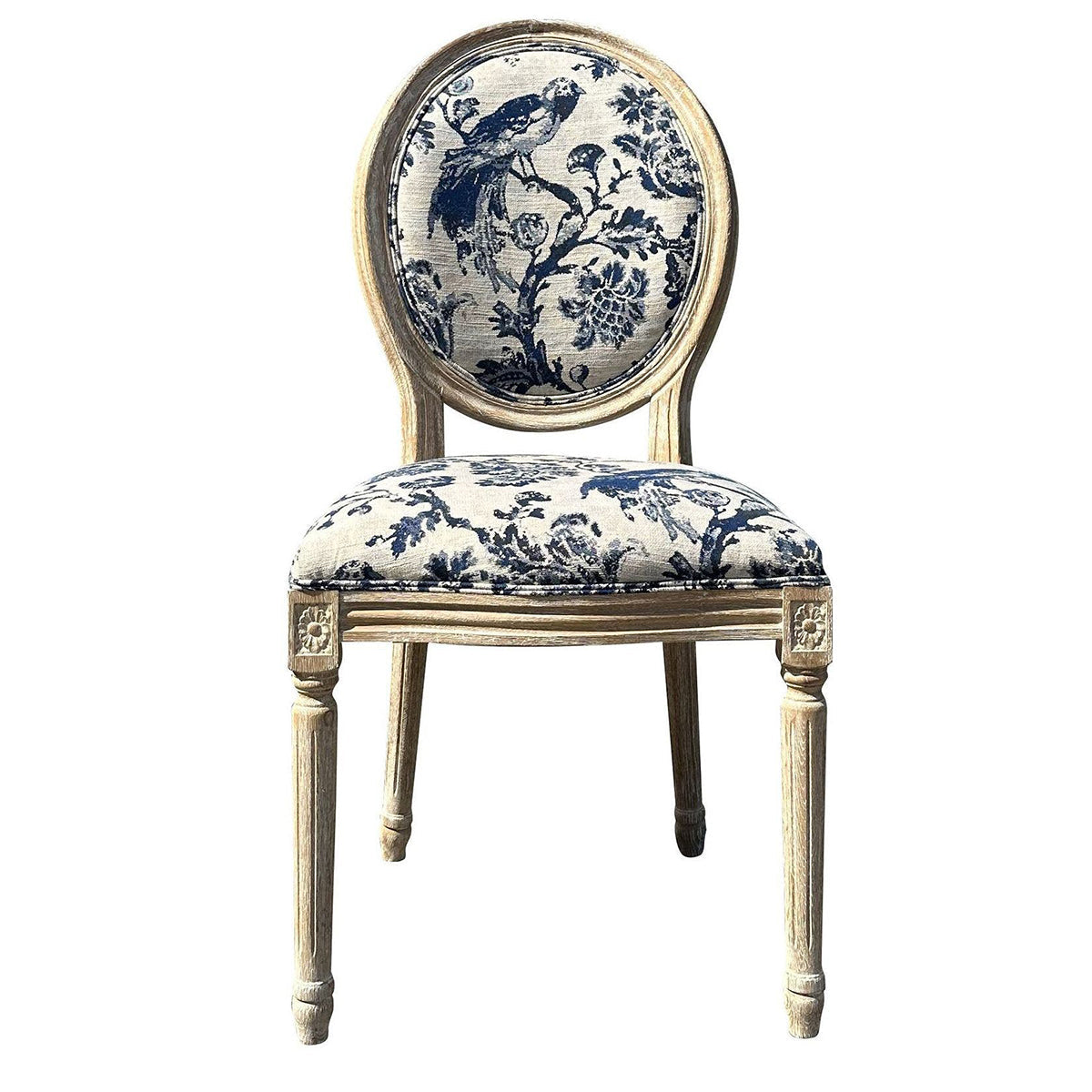 An elegant vintage-style dining chair with a distressed cream-colored wooden frame and blue floral toile patterned upholstery on the backrest and seat cushion, shown against a plain white background.