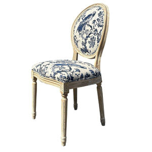 An antique-style dining chair with a distressed light beige wood frame and blue and white toile patterned upholstery on the seat and oval backrest, shown on a white background with a product code text overlay in the bottom right.