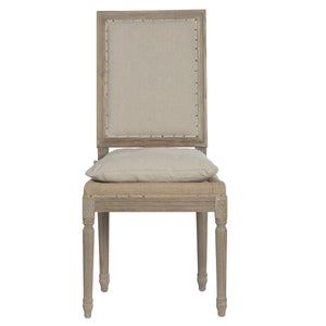 Beige upholstered chair with wooden frame on a white background