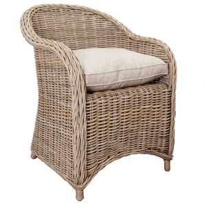 Wicker armchair with a cushion on a white background