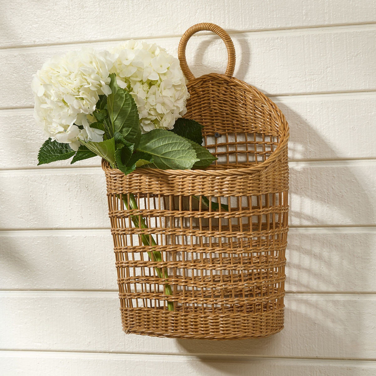 Decorative storage basket with white flowers