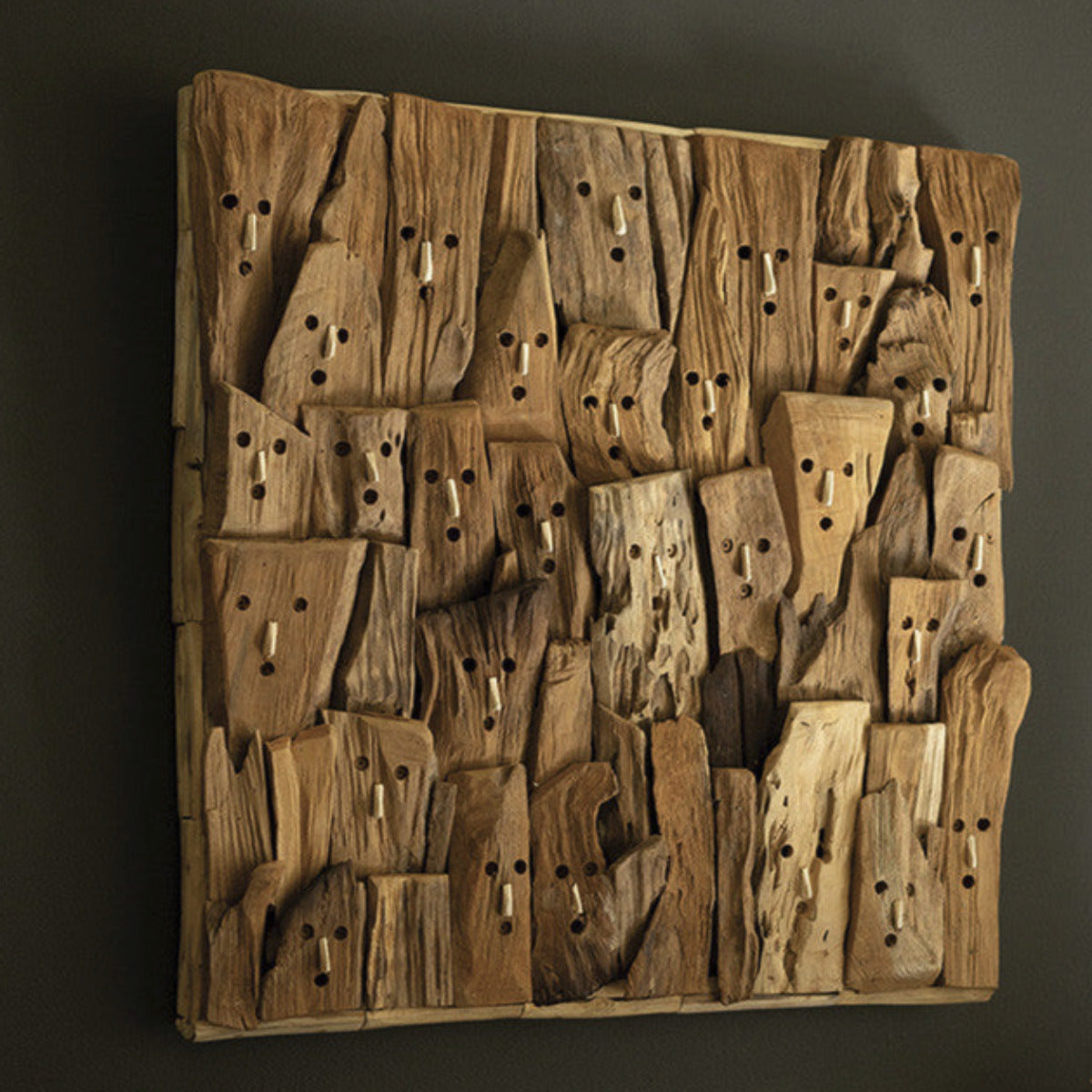 Repurposed Driftwood Faces Wall Art - This crowd of surprised onlookers would be perfect for a shower room at a beach house. Hang this driftwood faces wall art as the centerpiece of your repurposed wood collection or make it a funny piece where you expect guests to get naked.  - 24" x 2.5" x 24"t