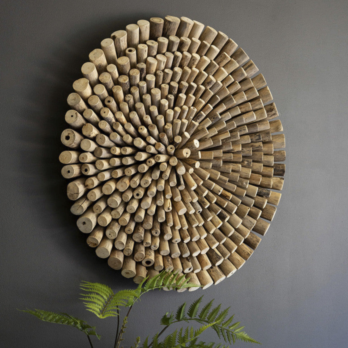 User Dridtwood Circle Wall Art - Use this round driftwood wall art for coastal cabins, beach bungalows, or abstract art spaces. Made in Indonesia, this kaleidoscopic piece is perfect for that empty beach house wall. Hang it in a place where you miss the ocean.  - 30"d 