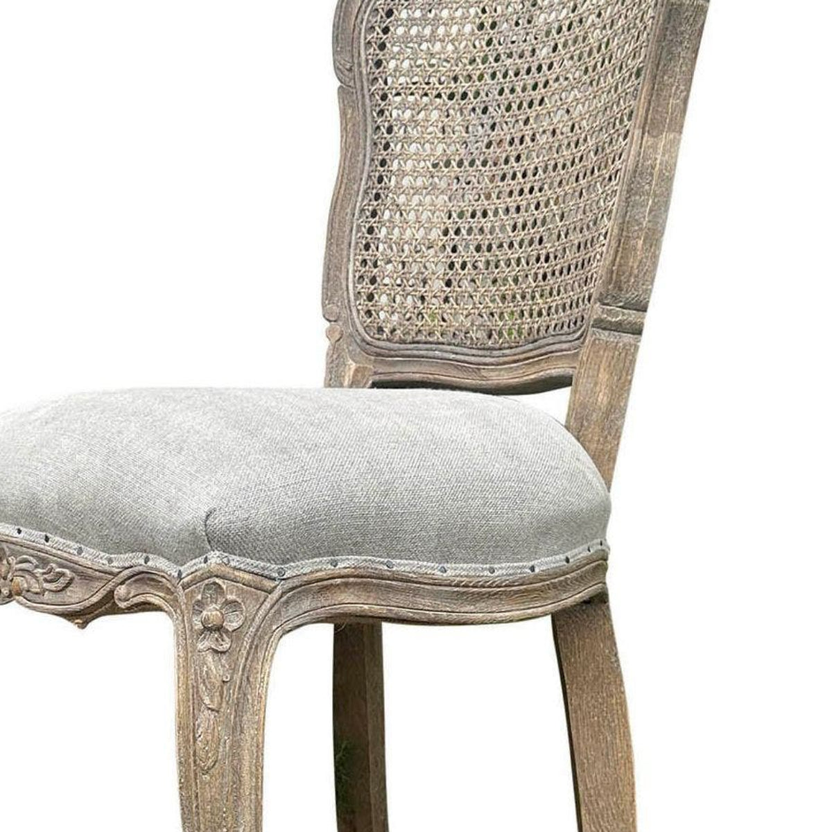 A single dining chair with a distressed light gray wood frame, a woven cane backrest, and a light gray upholstered seat cushion, shown on a plain white background with a model number printed below.