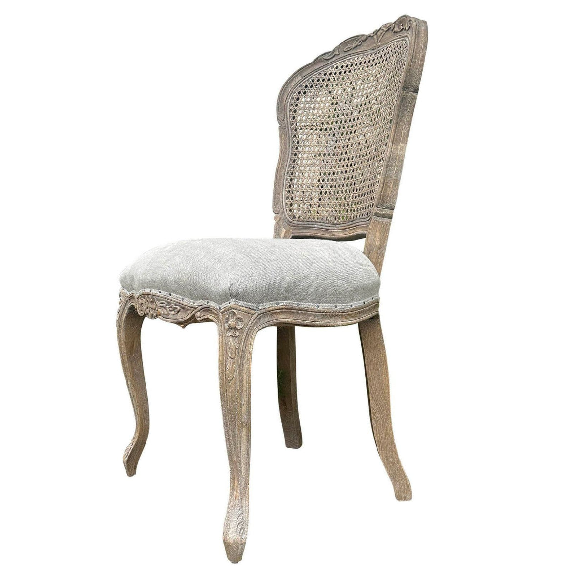 A single dining chair with a distressed light gray wood frame, a woven cane backrest, and a light gray upholstered seat cushion, shown on a plain white background with a model number printed below.