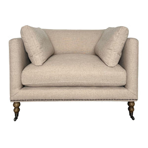 A light beige upholstered loveseat with two matching back cushions, dark wooden legs, and nailhead trim along the front, shown on a white background with a model number and dimensions below.