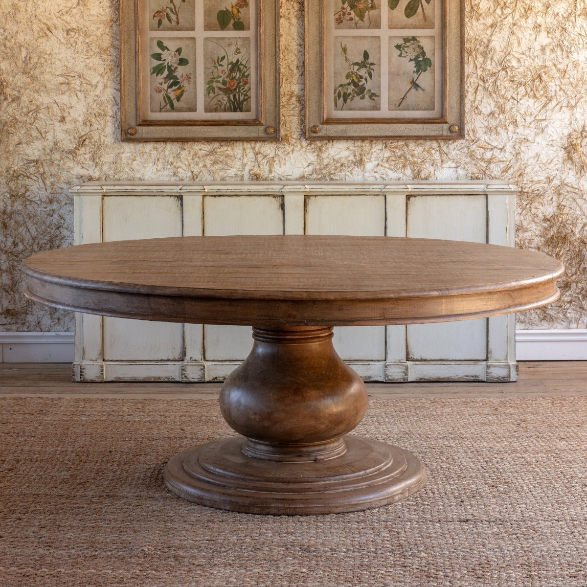 Warm dining room featuring a sculptural table base and wood tabletop