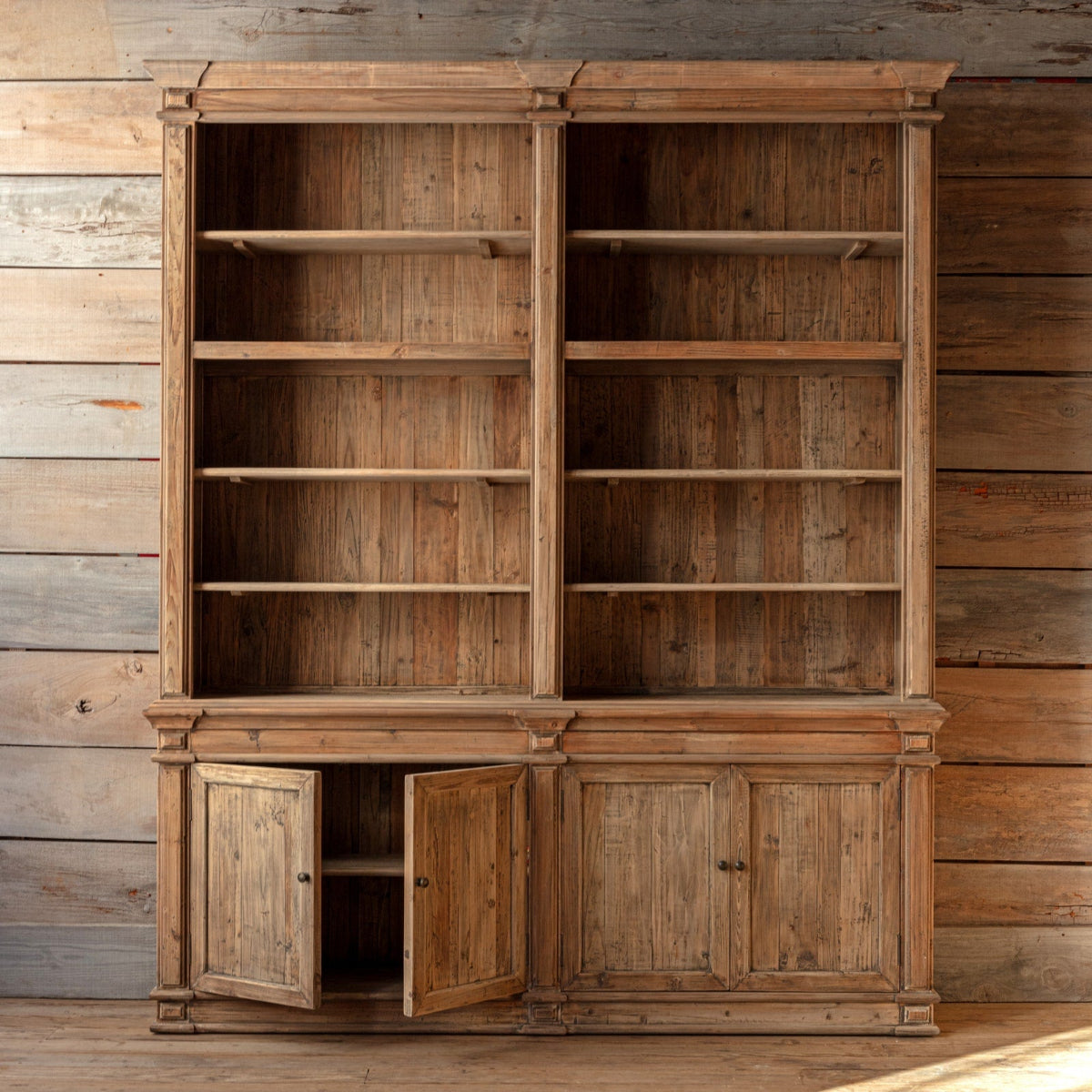 Tall wood library bookcase with open shelves and lower cabinet storage