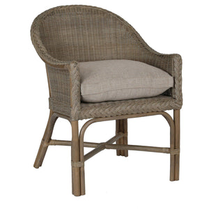 Wicker chair with a cushion on a white background