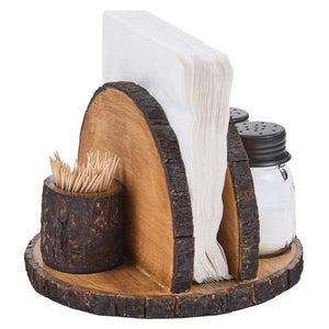 A rustic wood slice napkin holder and tabletop organizer set on a white background. The set includes a round base, a large upright wood slice divider, a smaller cylindrical wood slice cup holding toothpicks, and two glass shakers with black lids for salt and pepper, with white napkins tucked behind the center slice.