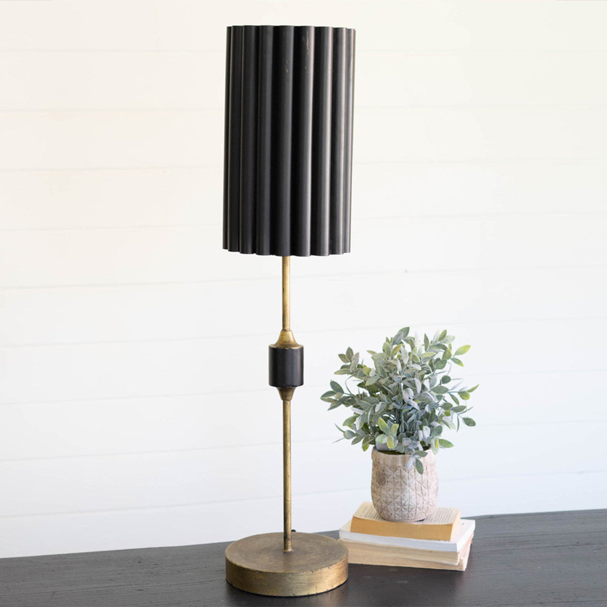 Black and gold table lamp with fluted metal shade