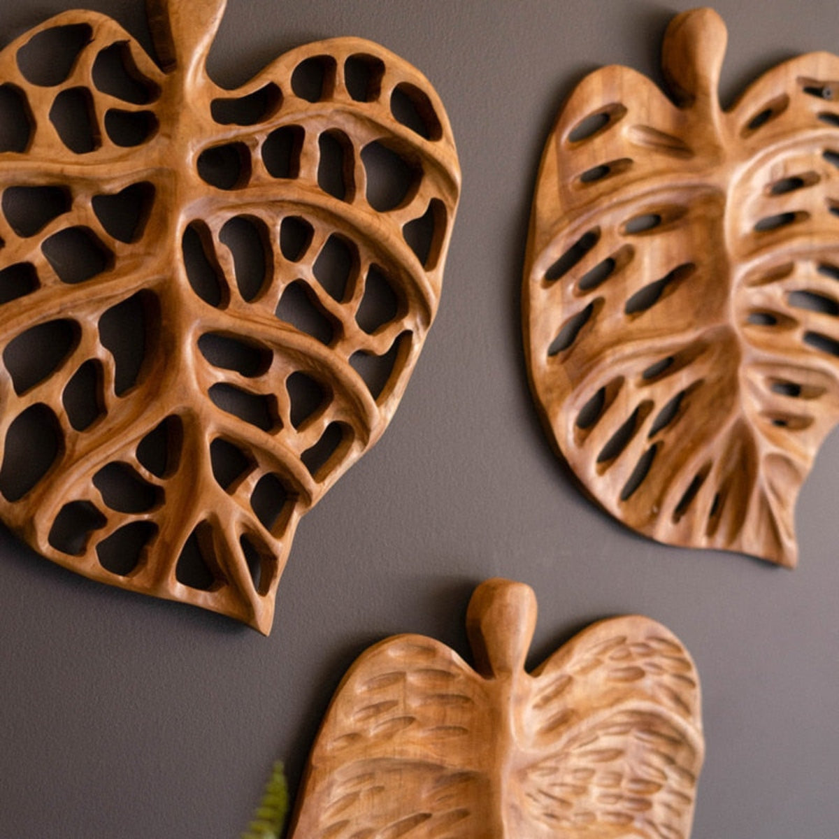 Detail of a hand-carved teakwood leaf