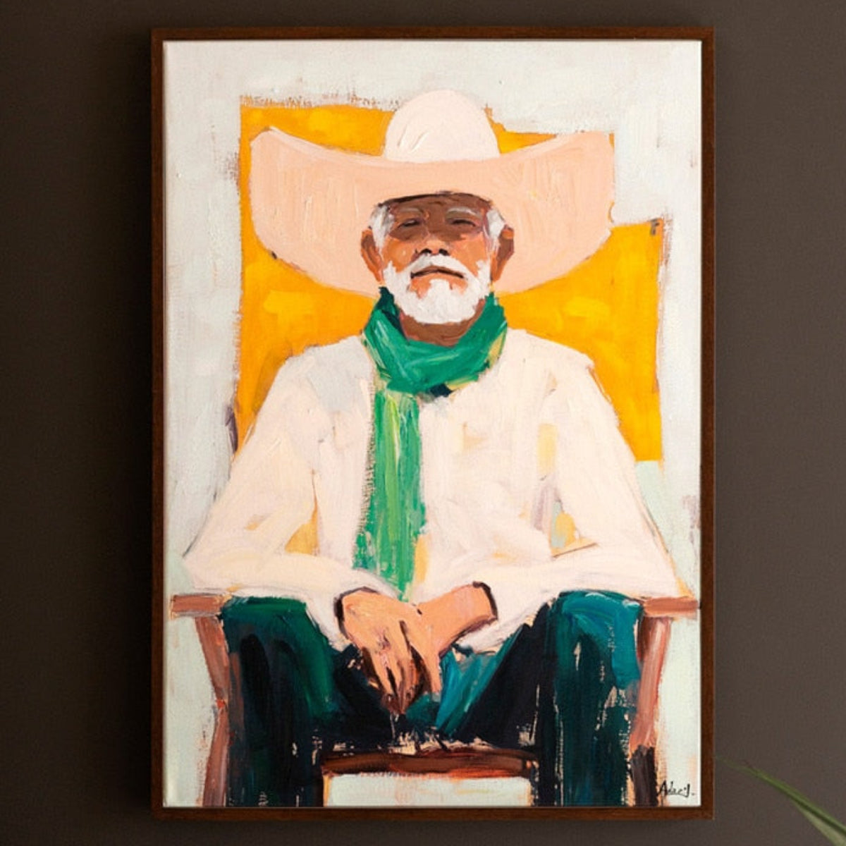 Framed cowboy painting hung on a wall