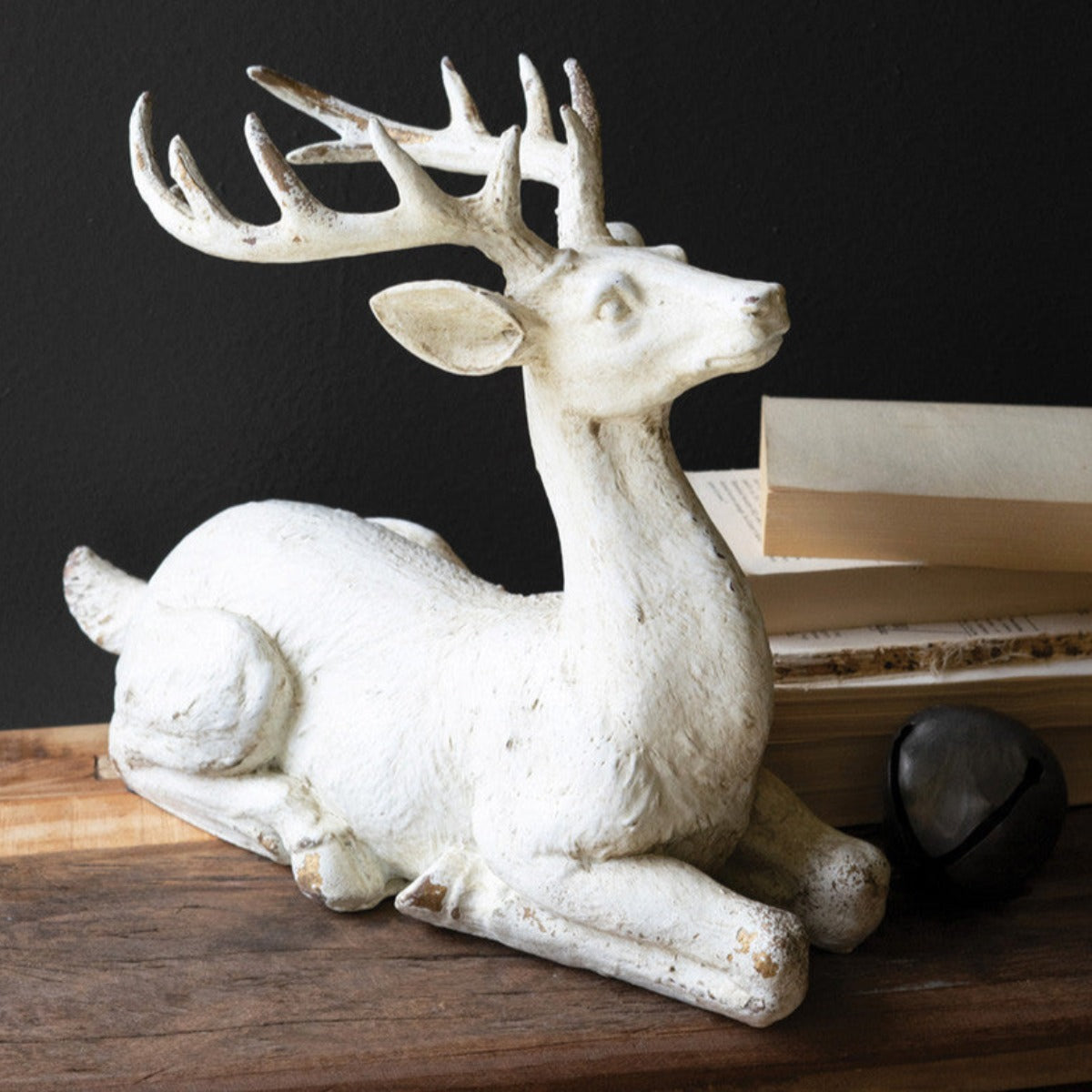 Distressed white faux concrete resting buck statue