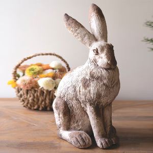 Faux concrete rabbit sculpture in earthy tones