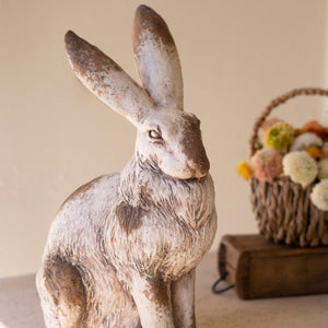 Faux concrete rabbit sculpture side view