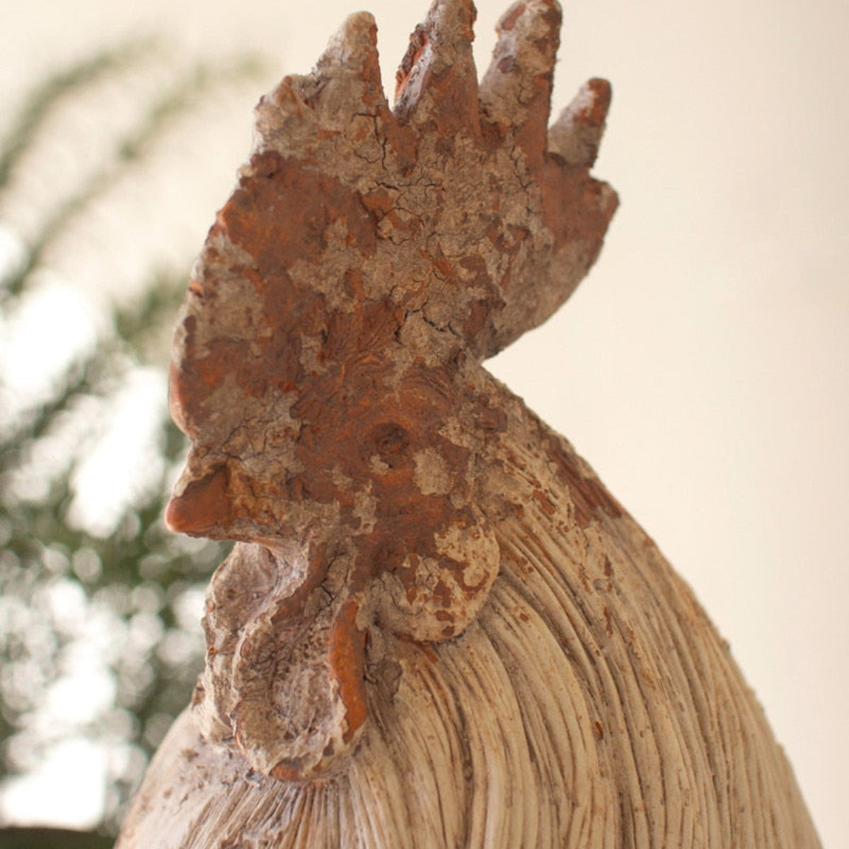 Faux concrete rooster with sculpted feather detail