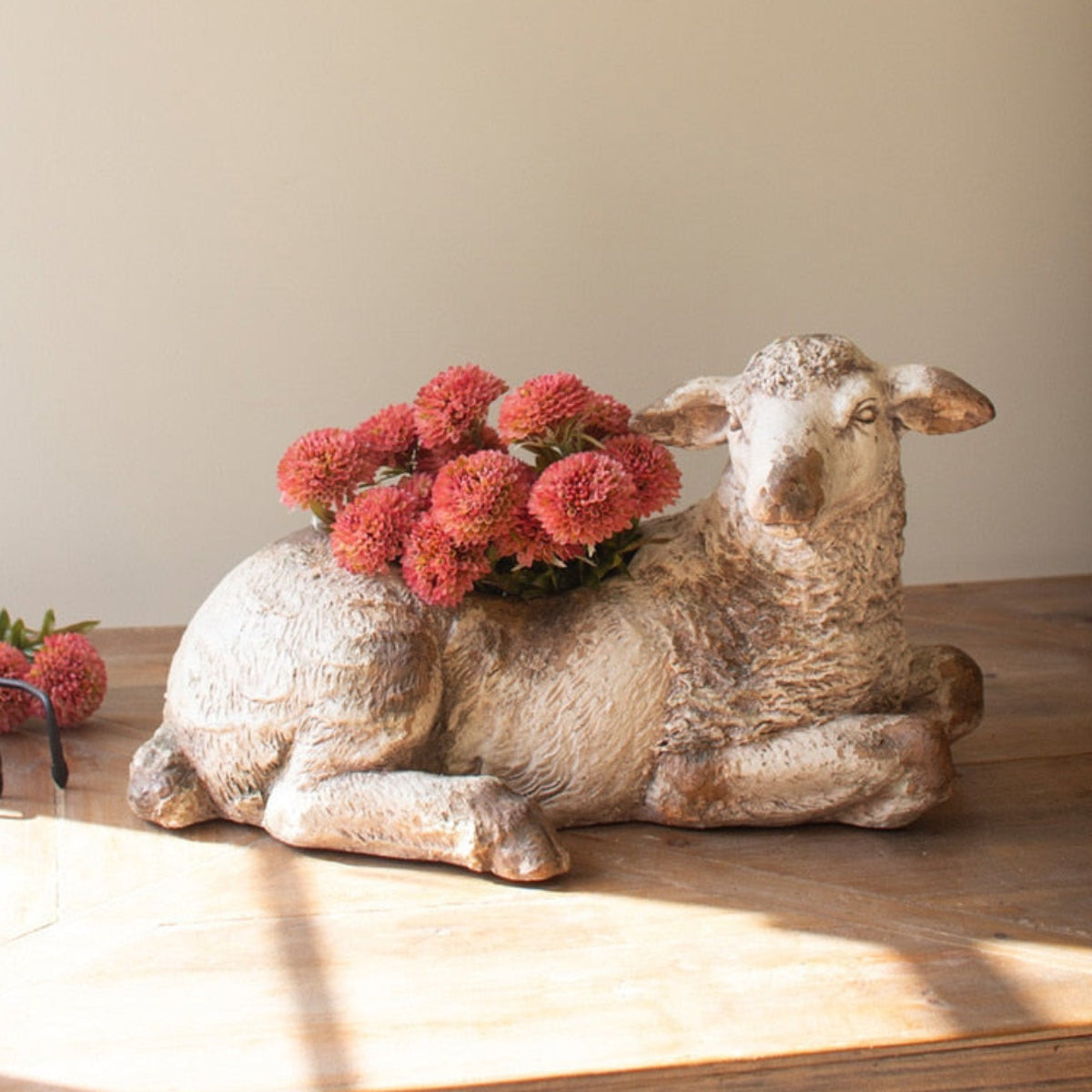 Faux concrete sheep planter with greenery