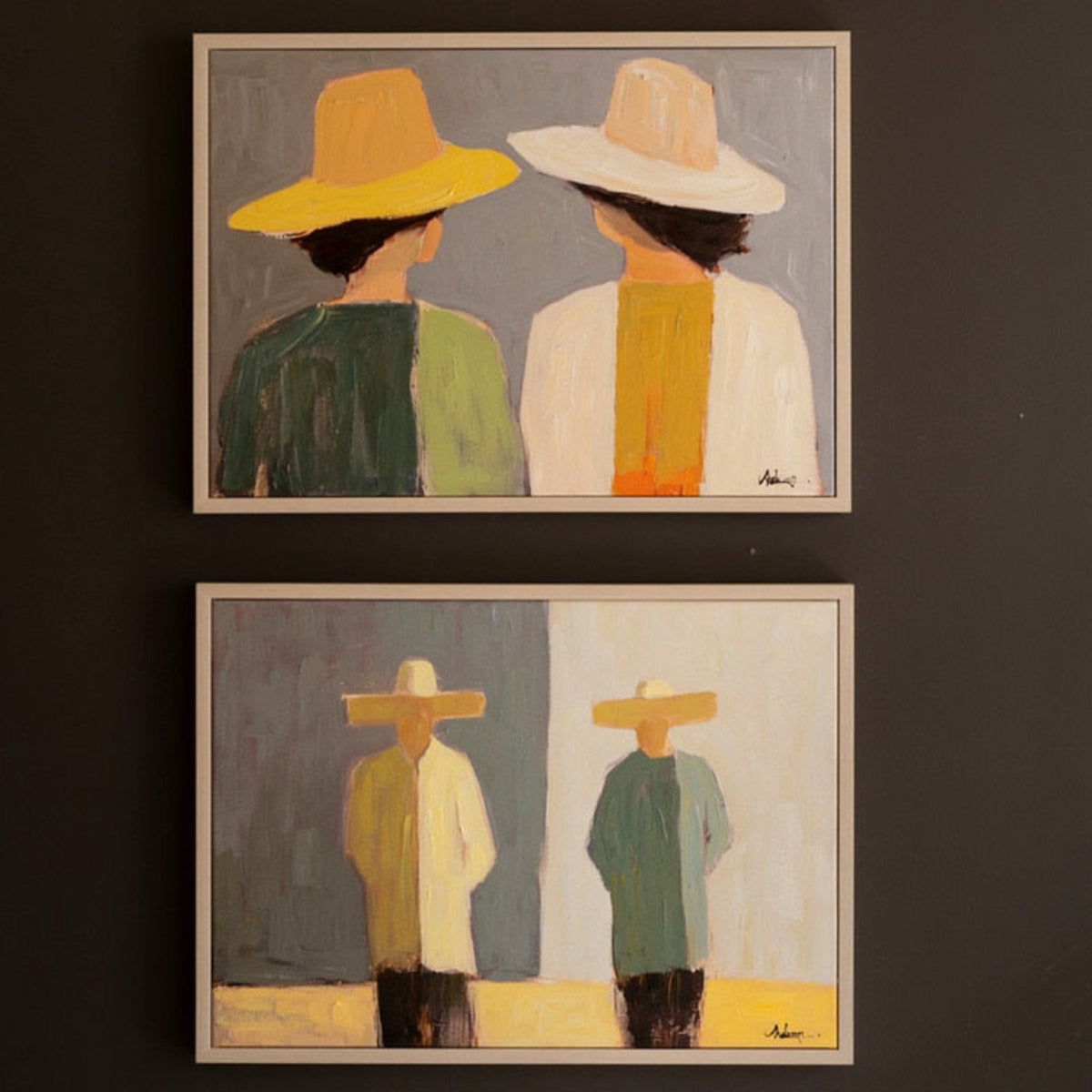 One of the framed portrait paintings in ochre and sage