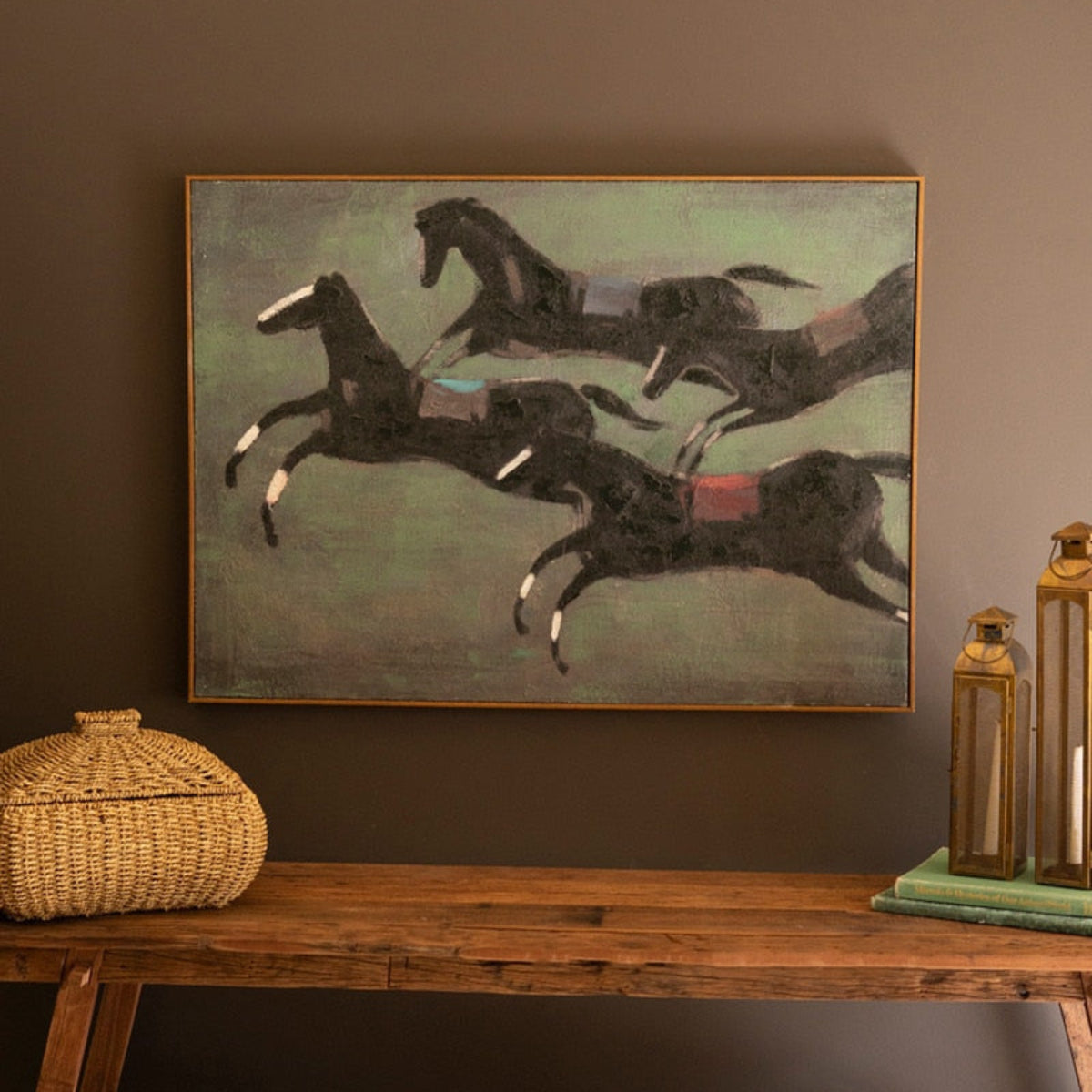 Framed painting of four race horses in full stride