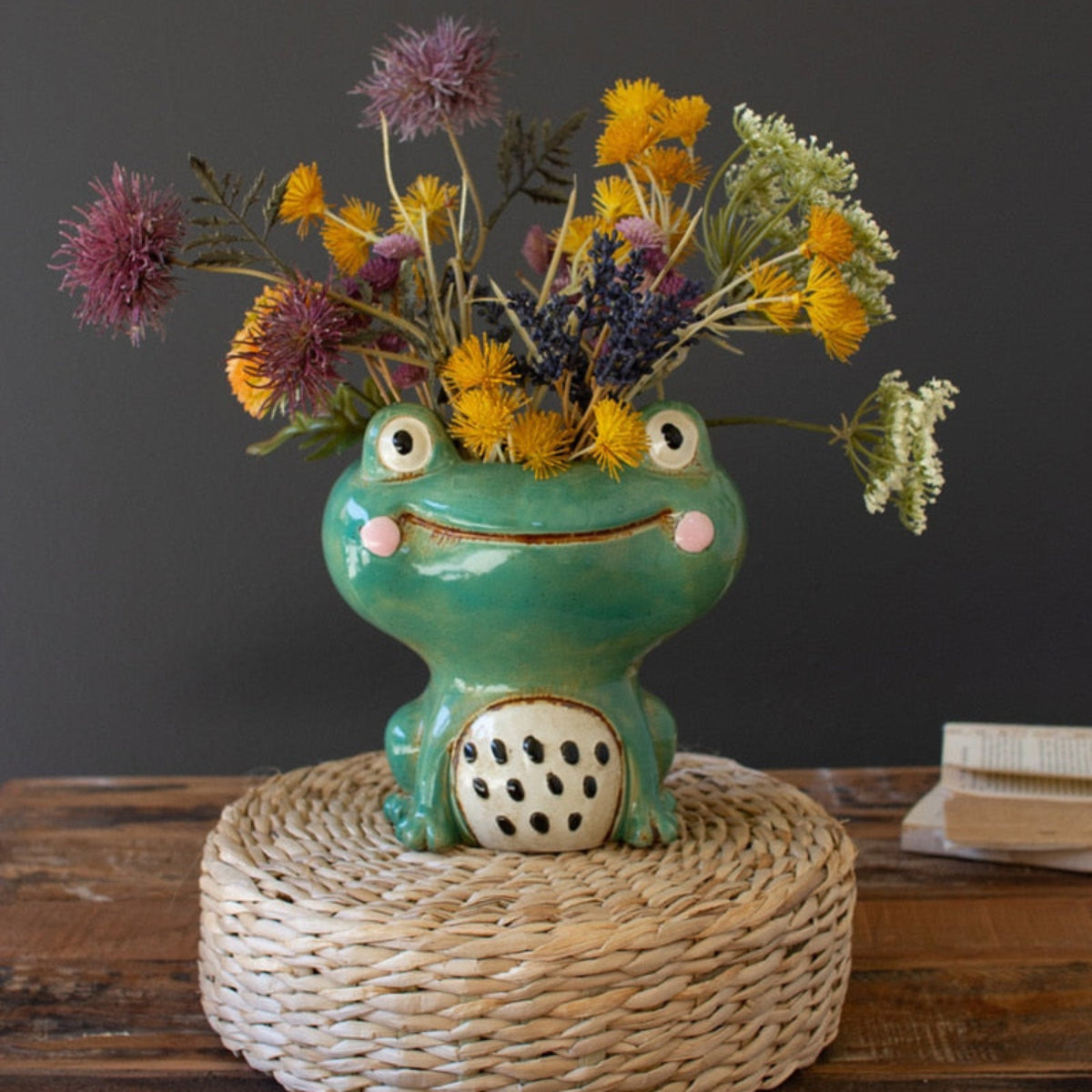 Smiling glazed ceramic frog planter with flowers