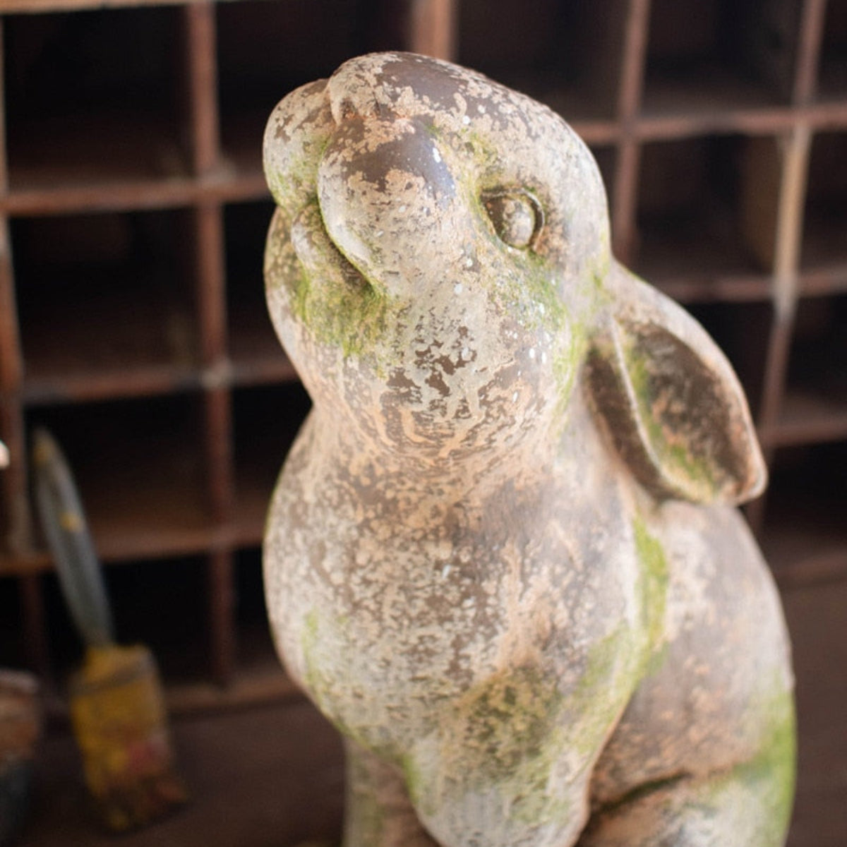 Garden rabbit statue with upturned nose