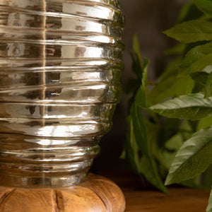 Close-up of ribbed glass lamp base