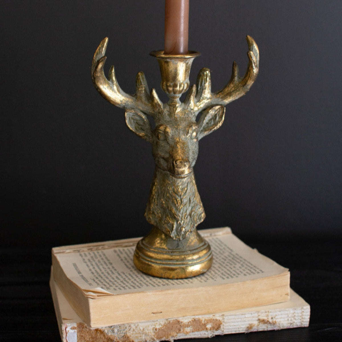 Two distressed gold resin deer taper candle holders