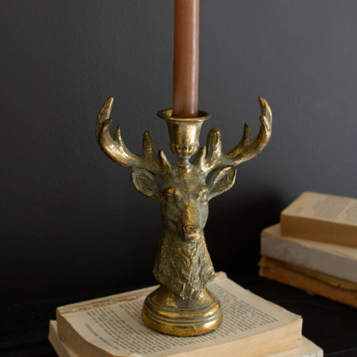 Two distressed gold resin deer taper candle holders