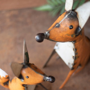 Recycled metal foxes styled as woodland decor
