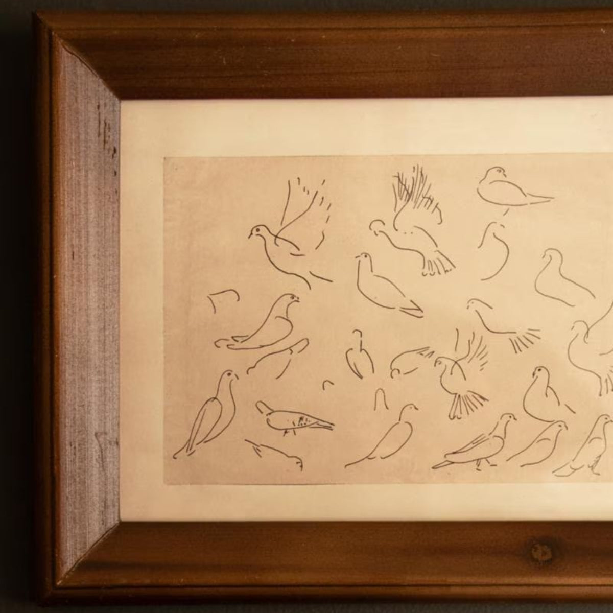 Detail of green painted wood frame on bird print