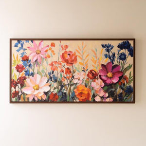 Painted Garden Blooms Canvas Art, wide framed floral painting hung on a wall