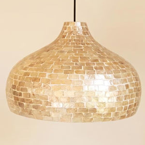 Neutral capiz shell dome pendant light on a white background