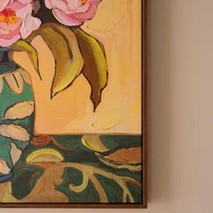 Angled view of framed floral still life canvas
